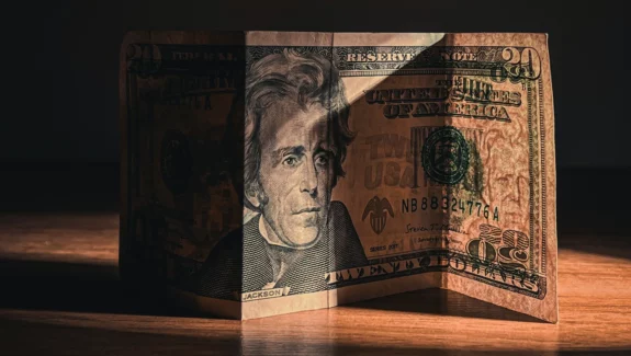 A banknote in shadow